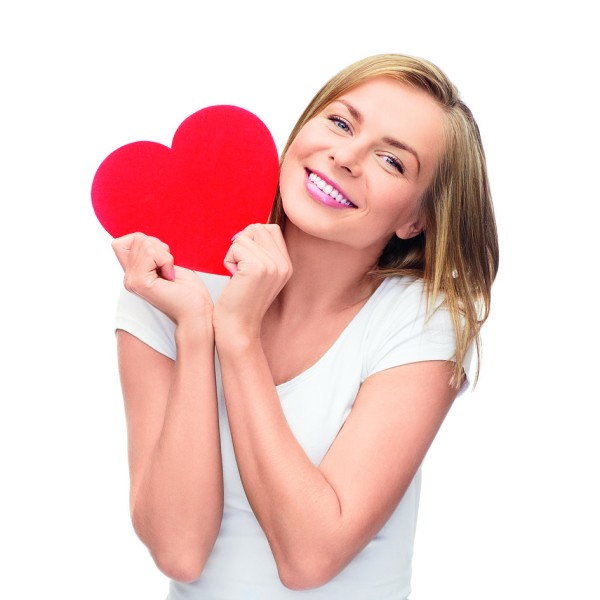 smiling woman in white t-shirt with heart