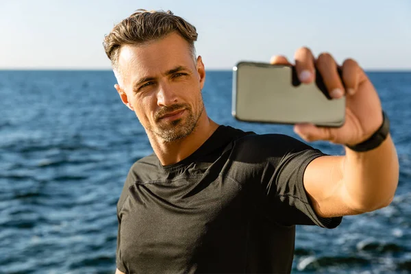 Handsome Adult Man Taking Selfie Smartphone Seashore — стоковое фото